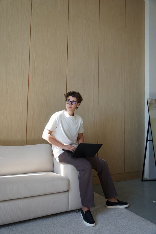 Hlieb Tovsteniuk working on a laptop